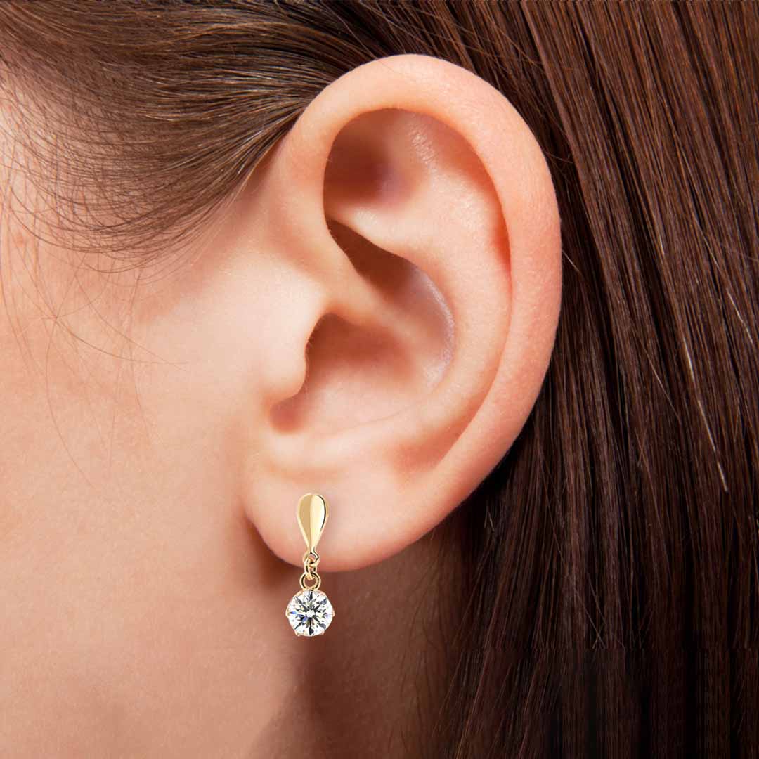Kultaiset korvakorut 5,5mm kirkkaalla zirkoniakivellä, 14K keltakulta - Image 3